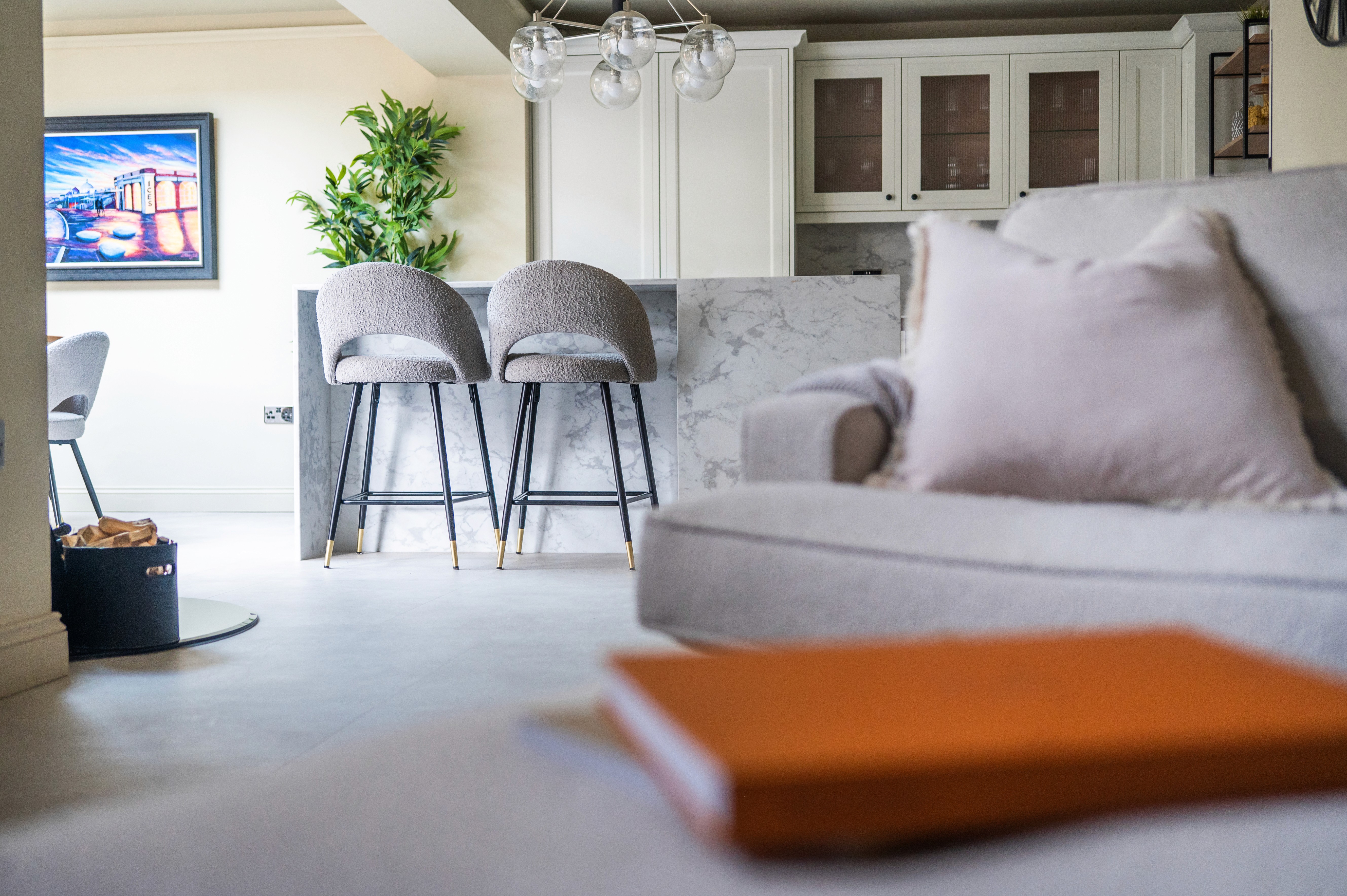 Background image featuring a modern interior design space for the testimonial Card