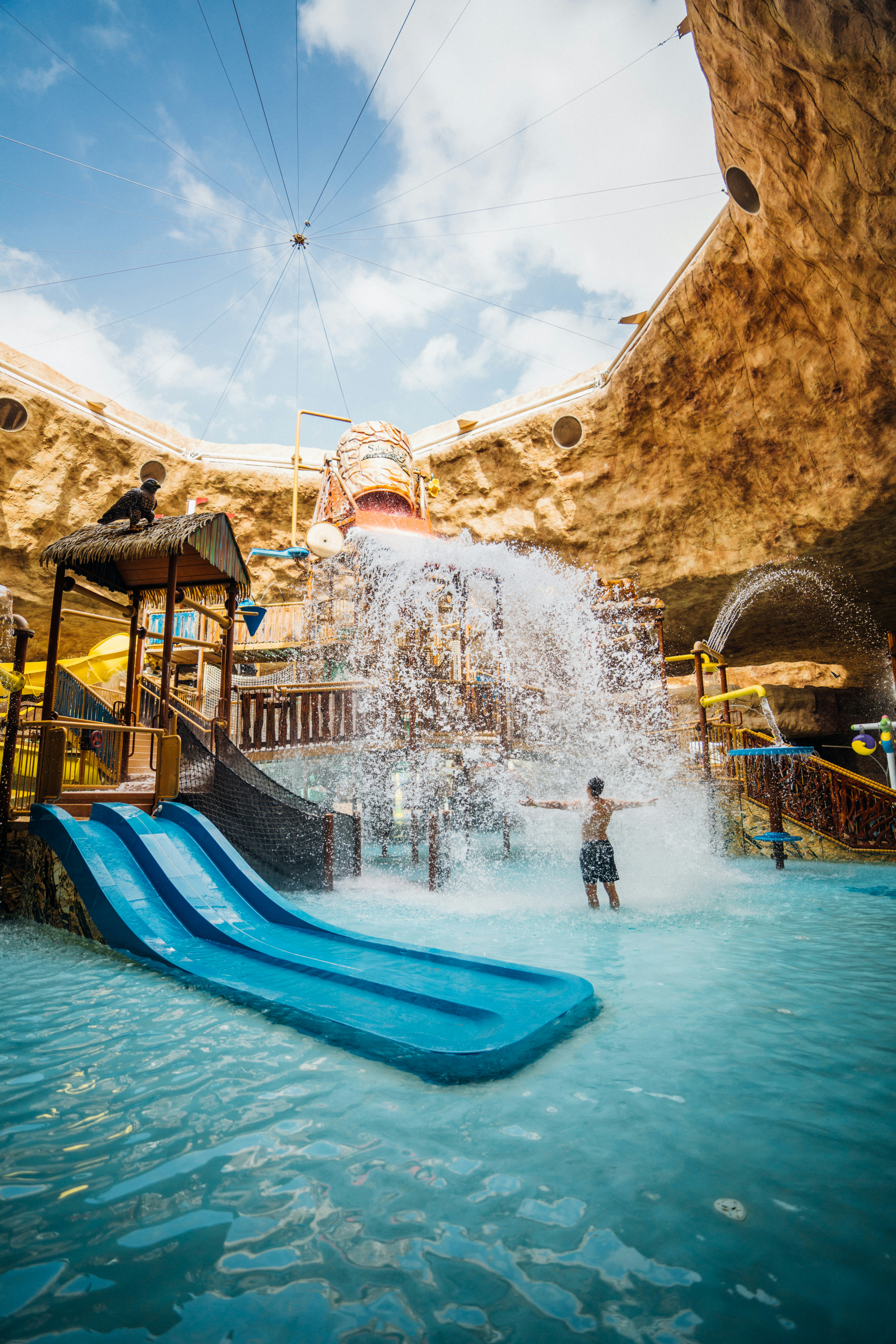 a water park with a water slide and a water slide