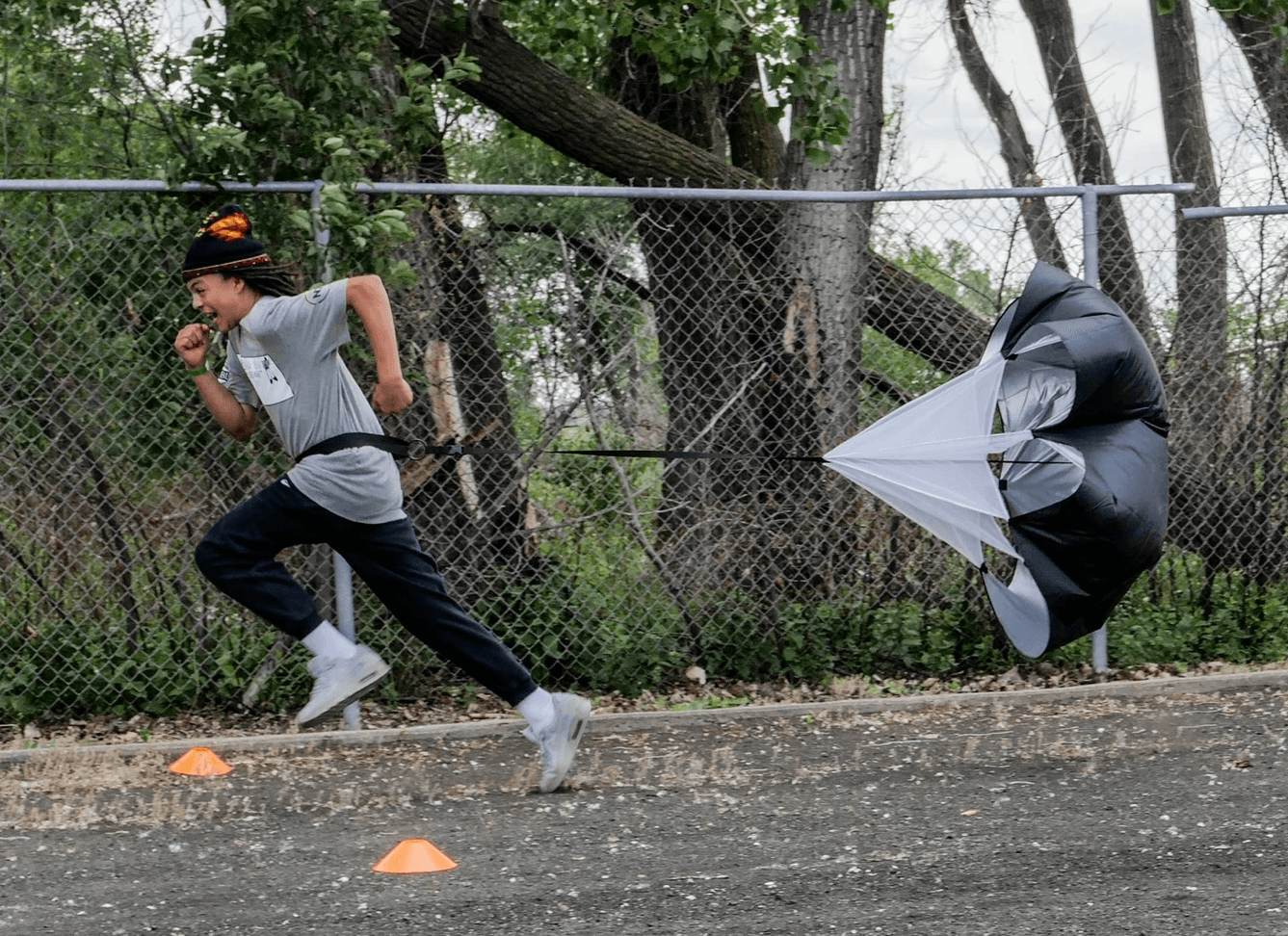 five children smiling while doing peace hand sign