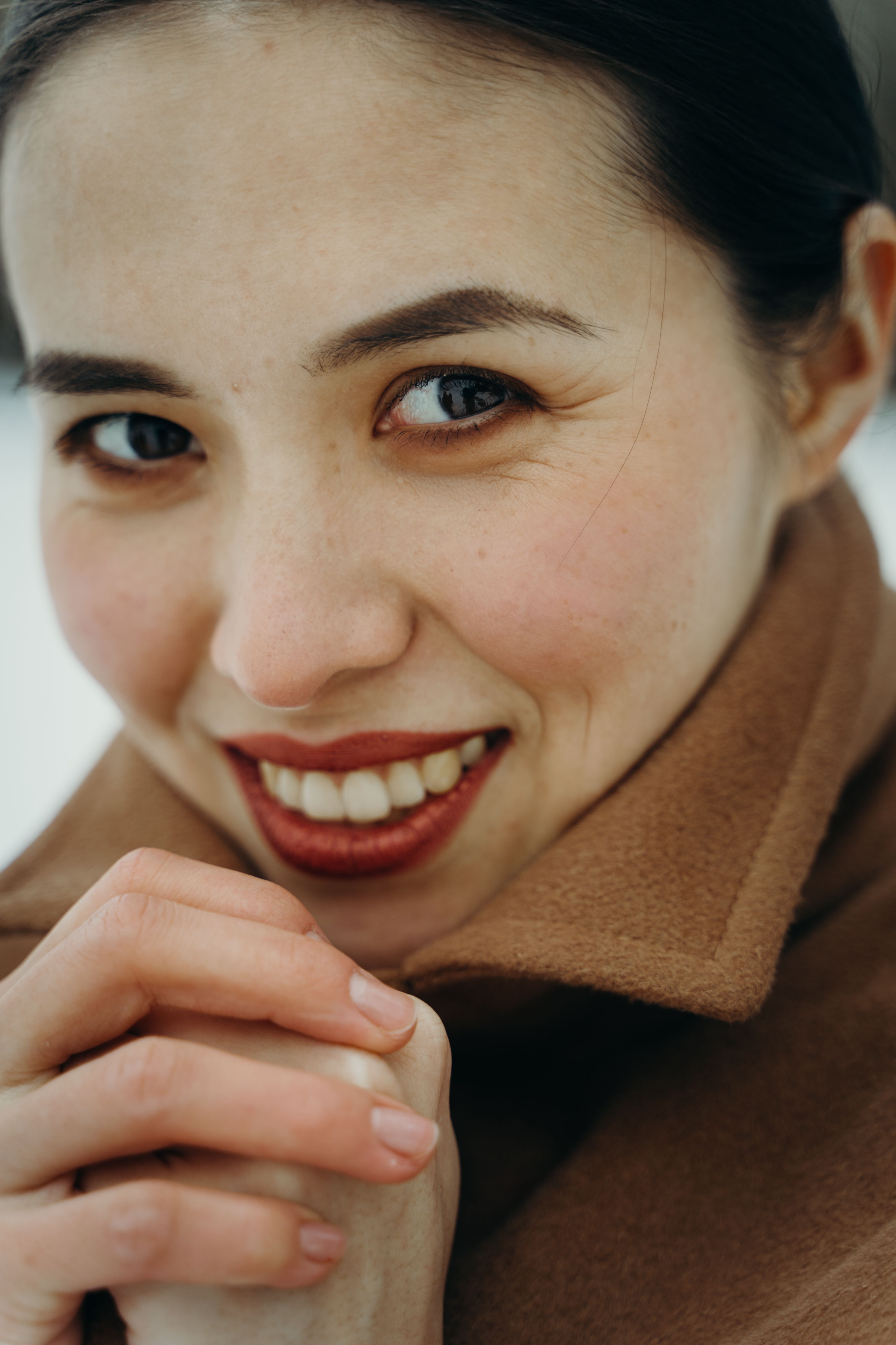A person smiling and making a funny face.