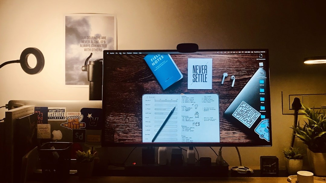 product designer reviewing ui mockups on desktop computer