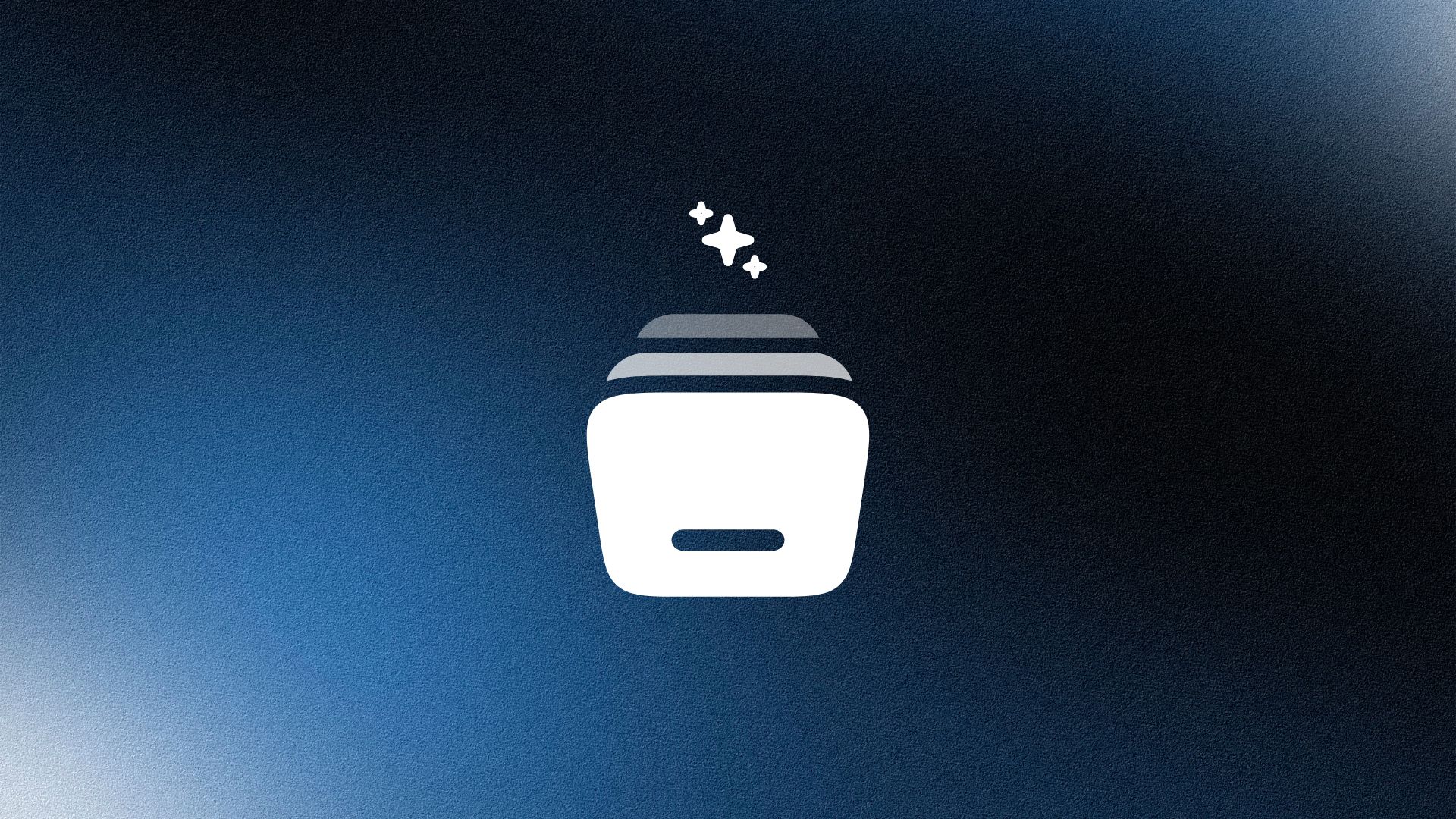 Man wearing a beige cap and dark shirt working on a laptop at a wooden desk with a plant in the background.