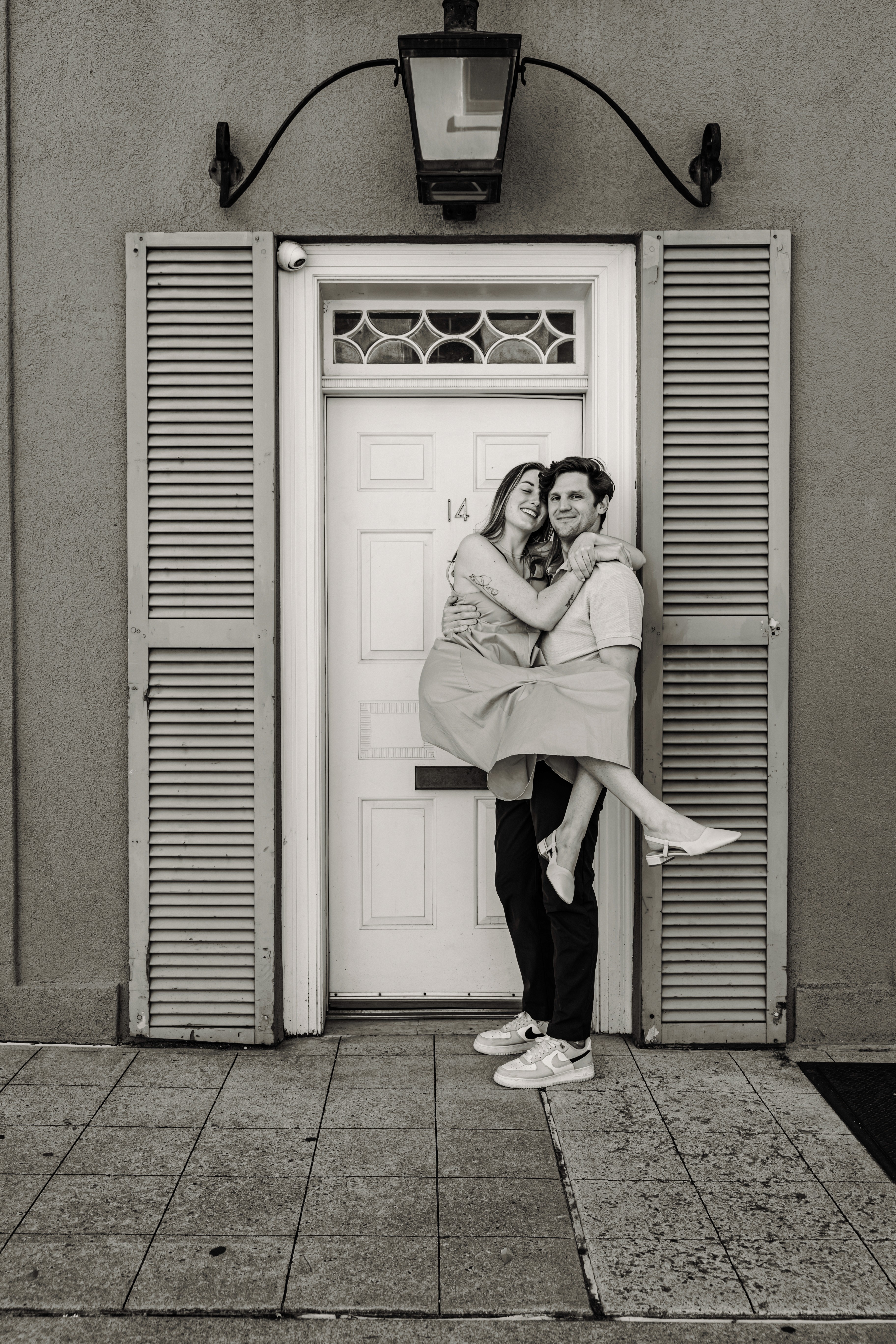 6:25 PMHe's swept her off her feet, her eyes closed in pure bliss — a breathtaking black and white couples portrait at the cobblestoned Washington Mews in Greenwich Village, NYC by Lizz Spano Photography, New York City couples photographer.