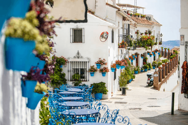 Traveler enjoying Andalusian tapas in a whitewashed village square
