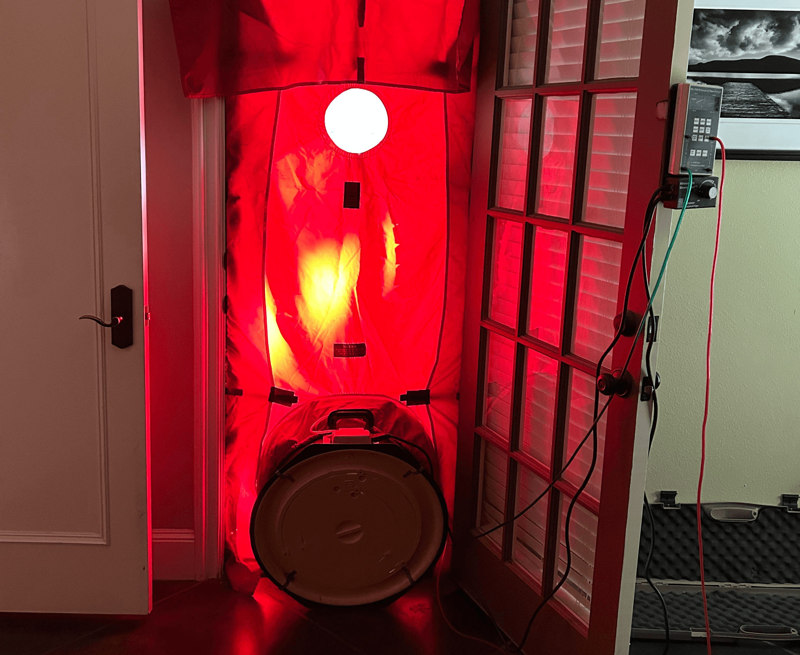 Home energy checkup in Dallas using blower door test to detect air leaks and airflow issues