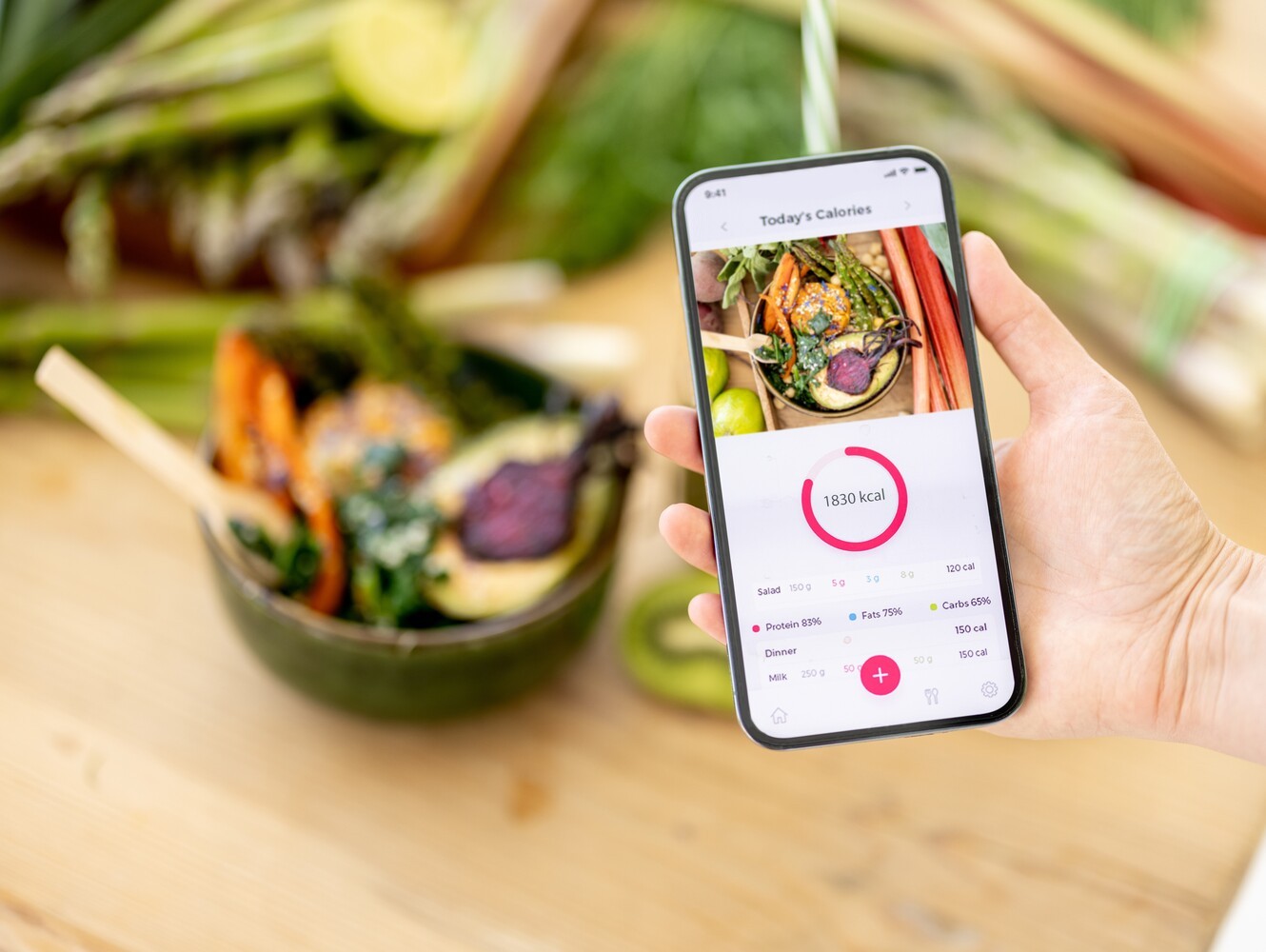 phone showing the calories of a healthy meal to support a calorie deficit for how long to walk for weight loss