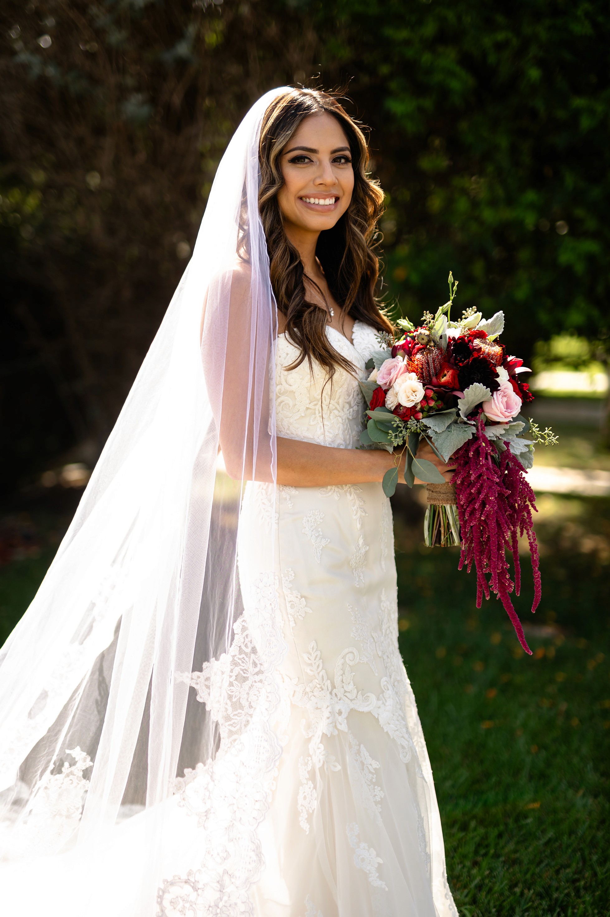 Flat lay wedding details with bouquet, rings, and sparkling bridal heels