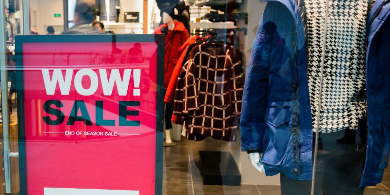 A sale sign outside of a Malaysian retail store