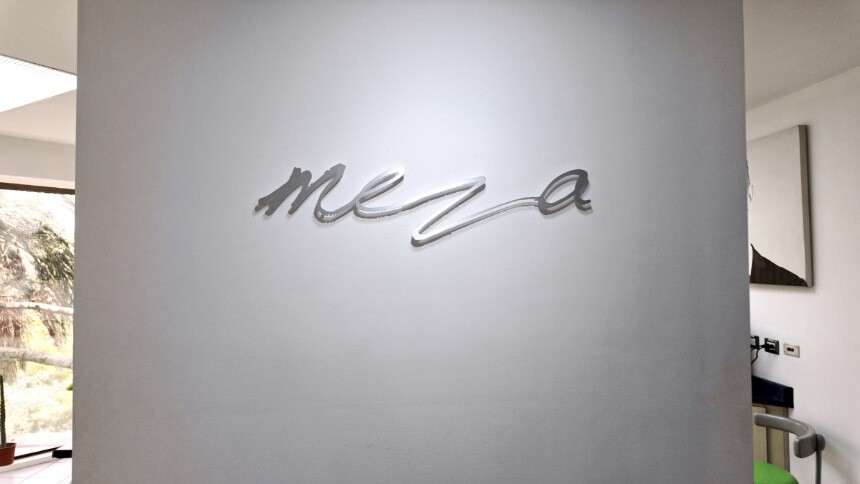 Dental clinic in Costa Rica, Meza Dental Care logo on a wall.