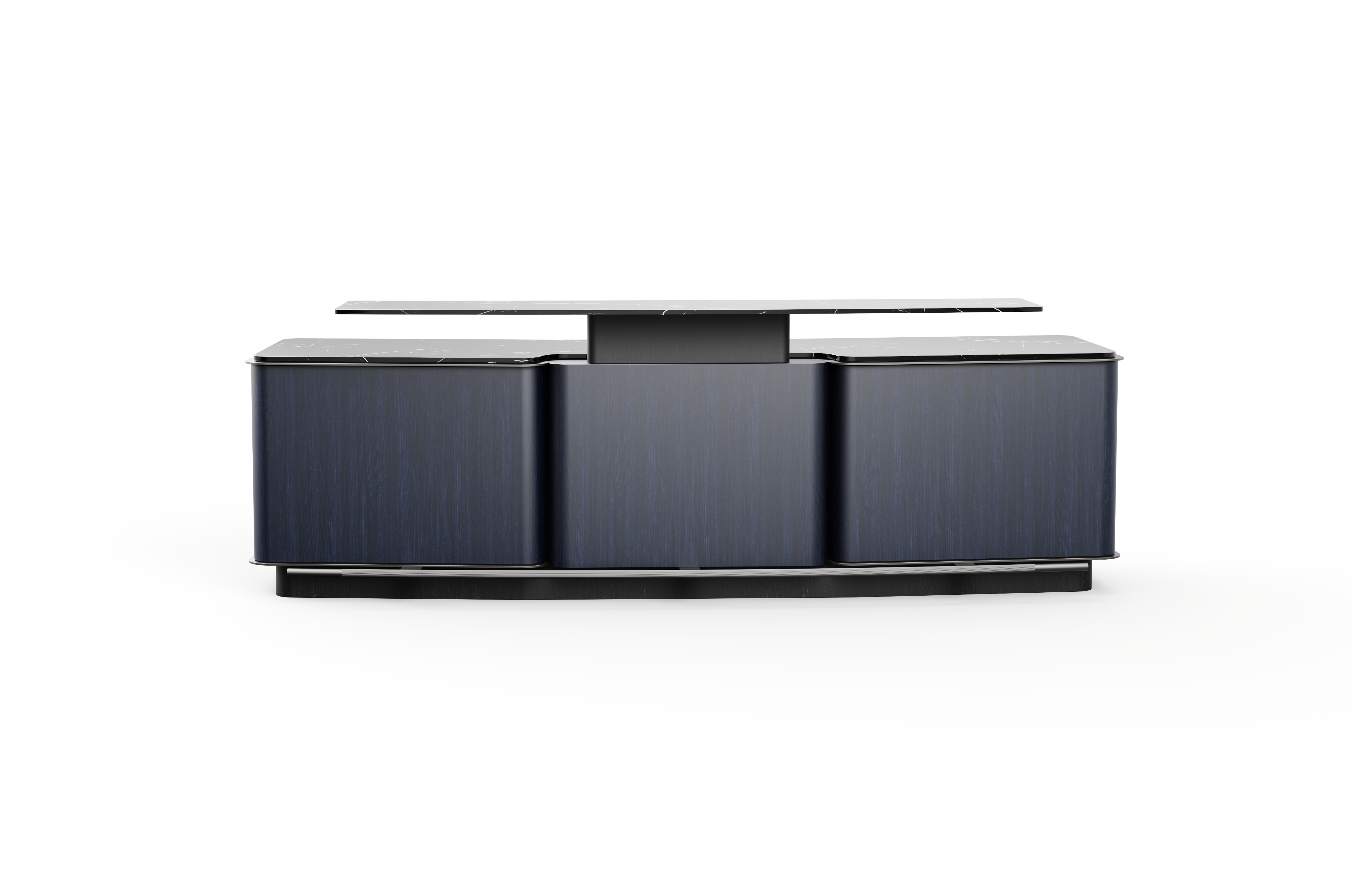 Futuristic glass skyscraper with a bold angular design, reflecting the surrounding city skyline at dusk.