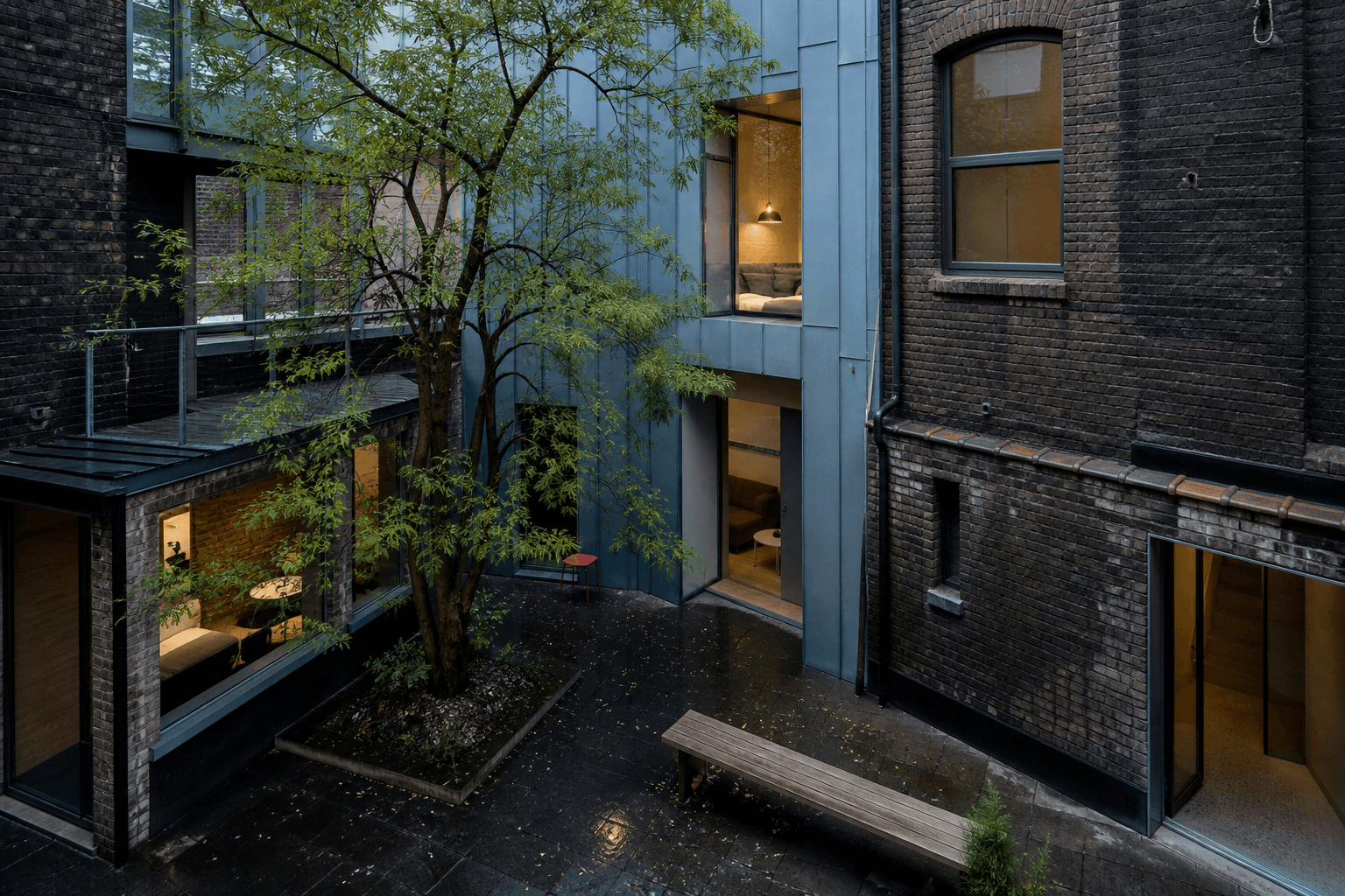 Dense city architecture organized around a planted private courtyard