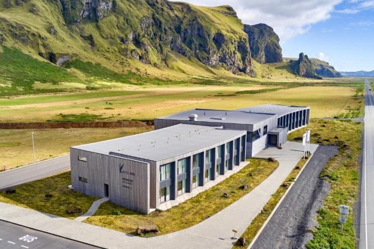 sunloungers fronting buildings near mountain