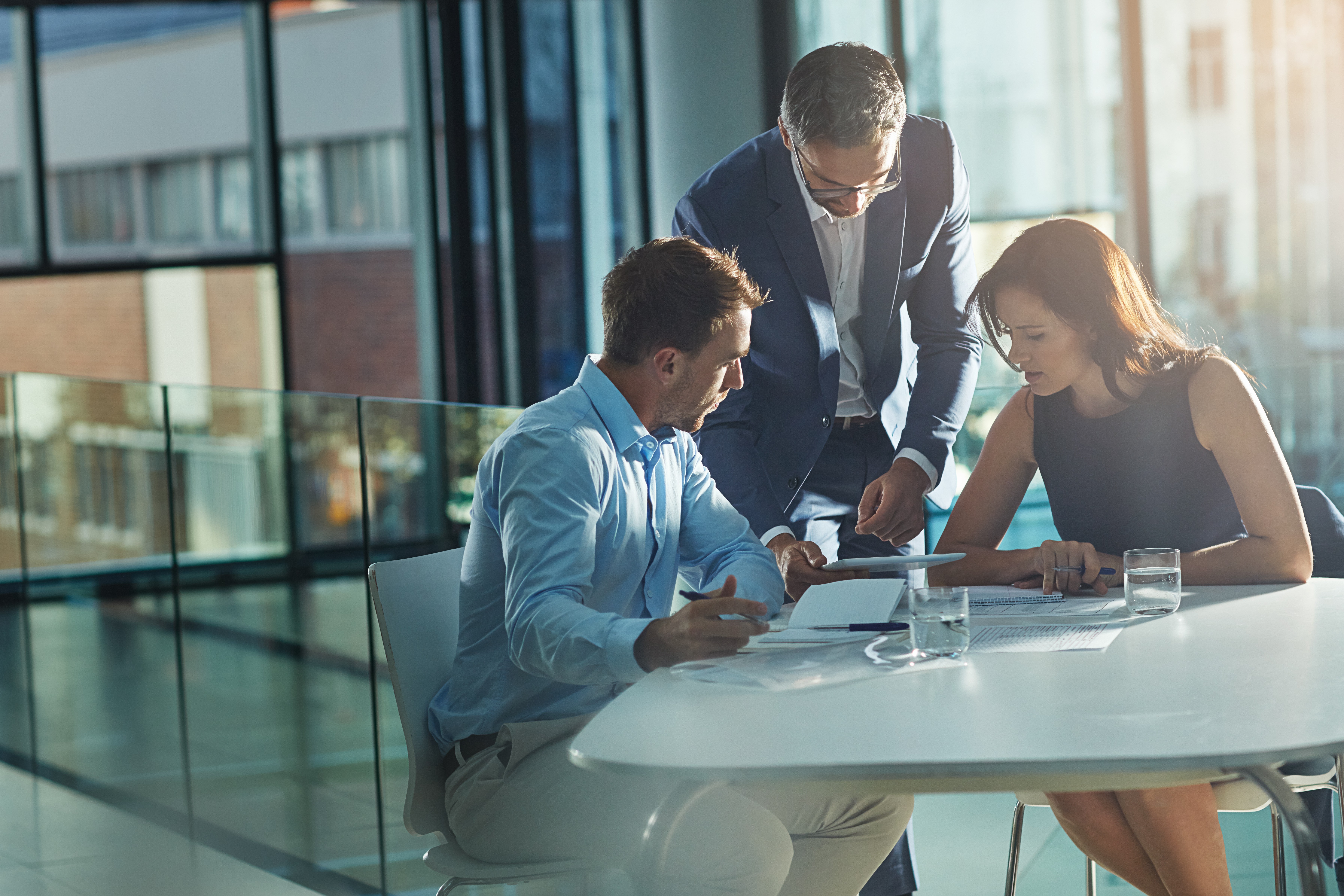 3 people working together in an office