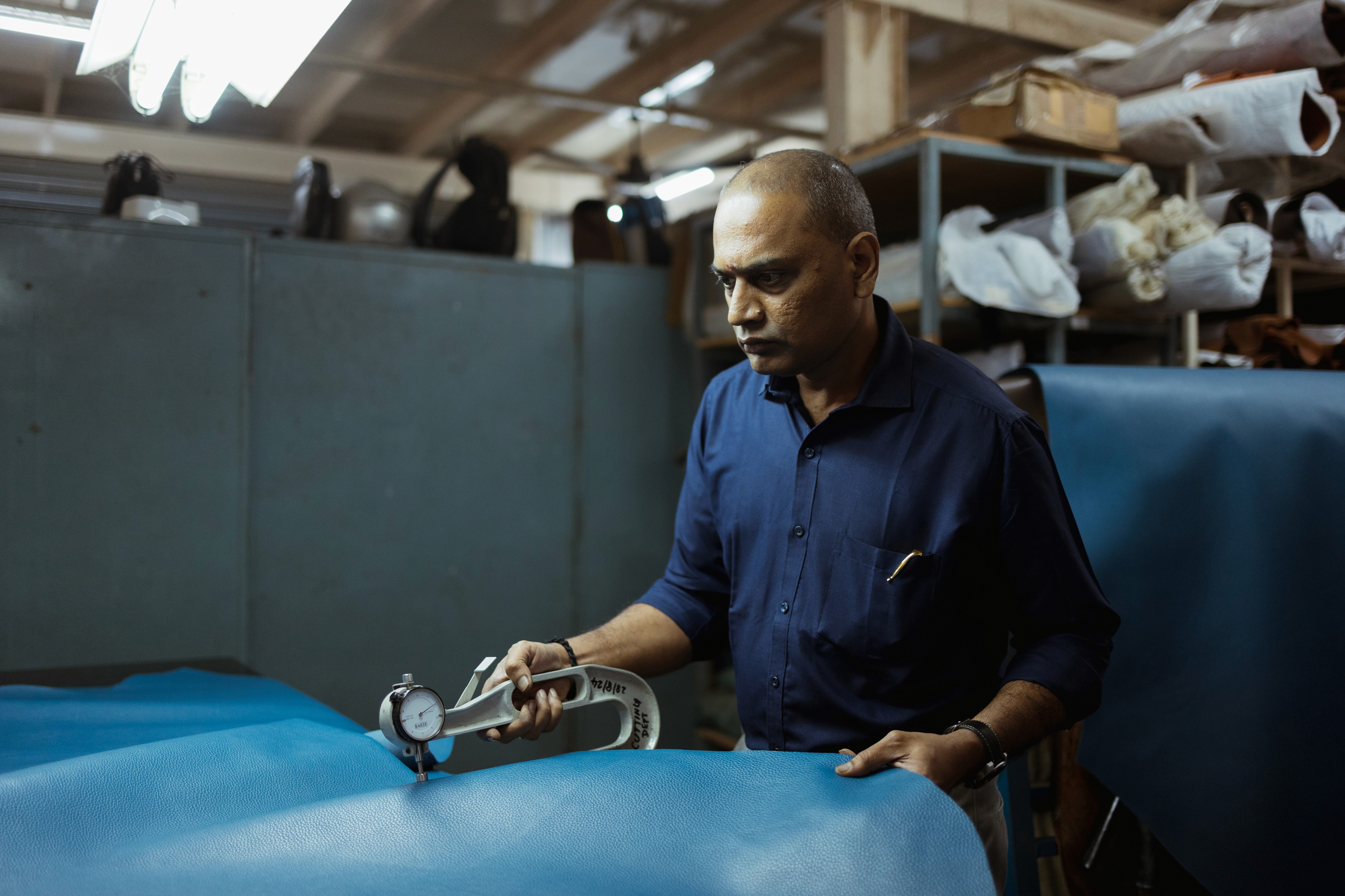 Worker Checking Leather Quality Image