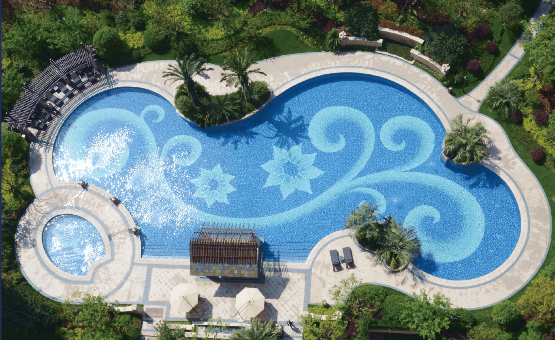 A plaster hand sculpture in focus while two people chat in the background