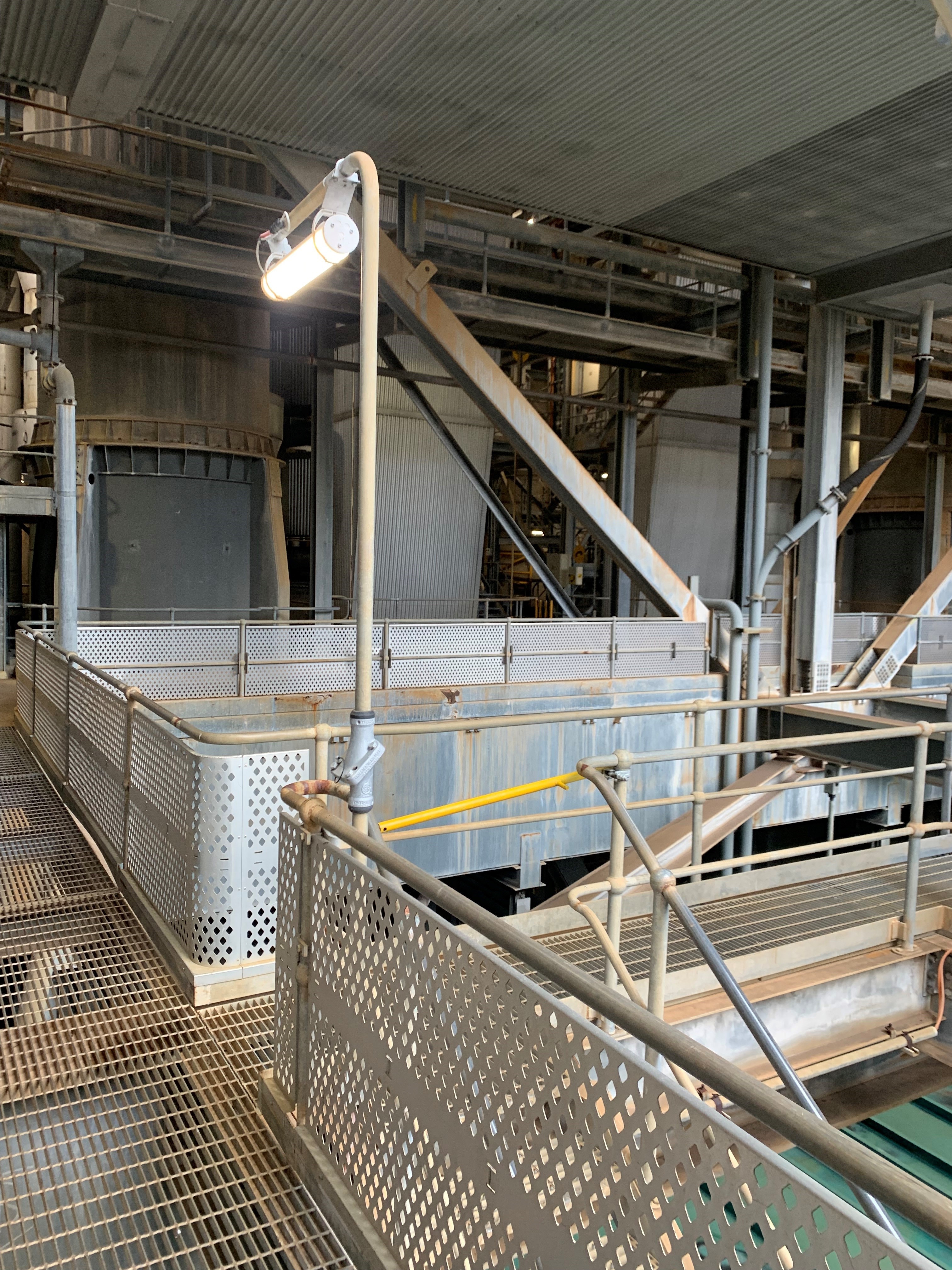 Swivelpole hinged lighting poles with lowering mechanisms for simplified fixture access in industrial and commercial sites in BC