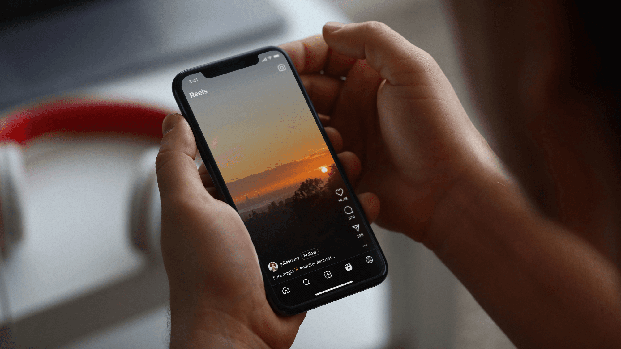 Watching sunset Reels video on smartphone - Instagram Reels Ideas for Business