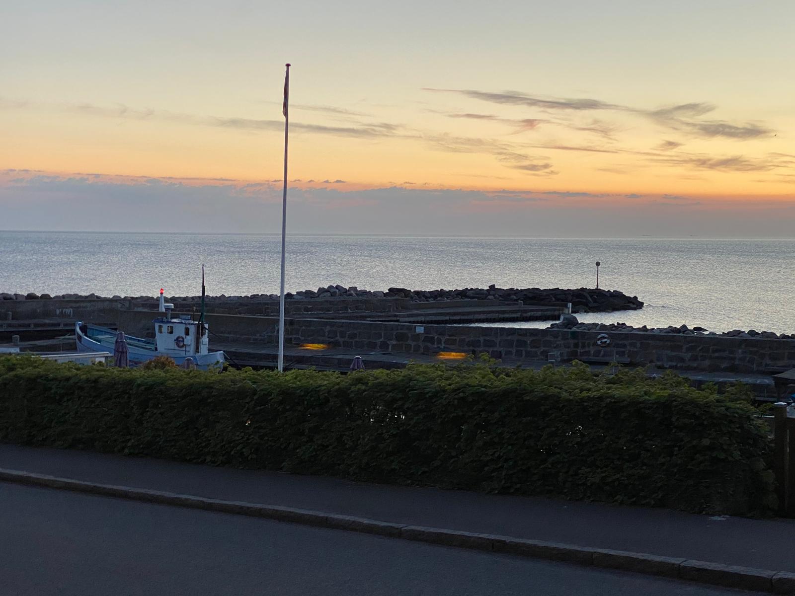 round brown wooden table near window