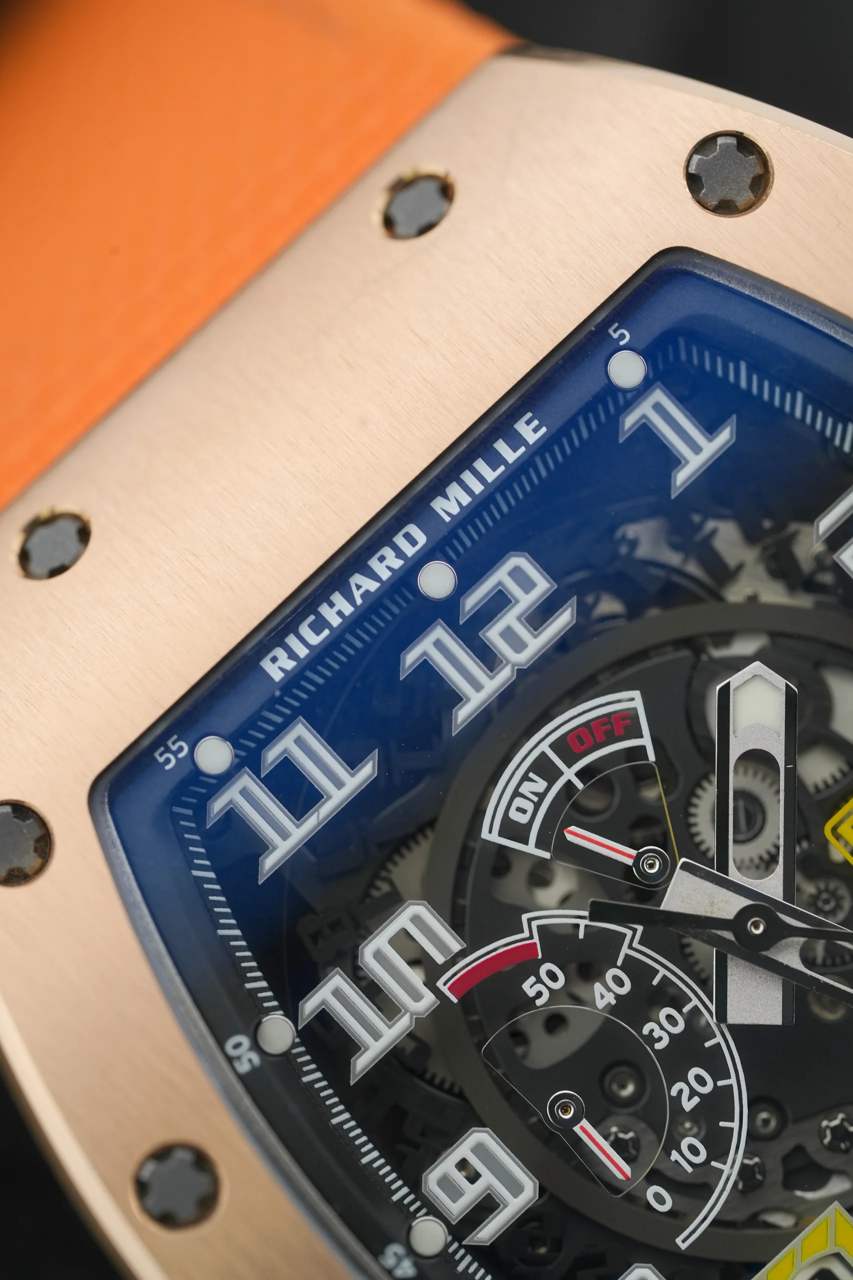 Macro shot of the Richard Mille RM 030 RG/TI Rose Gold & Titanium hands and markers