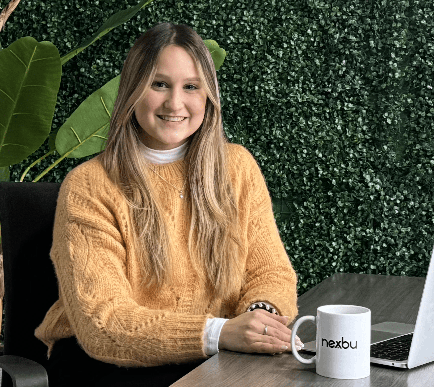 Man with a laptop walking to a store