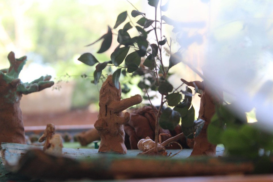 person sitting on grass and using phone