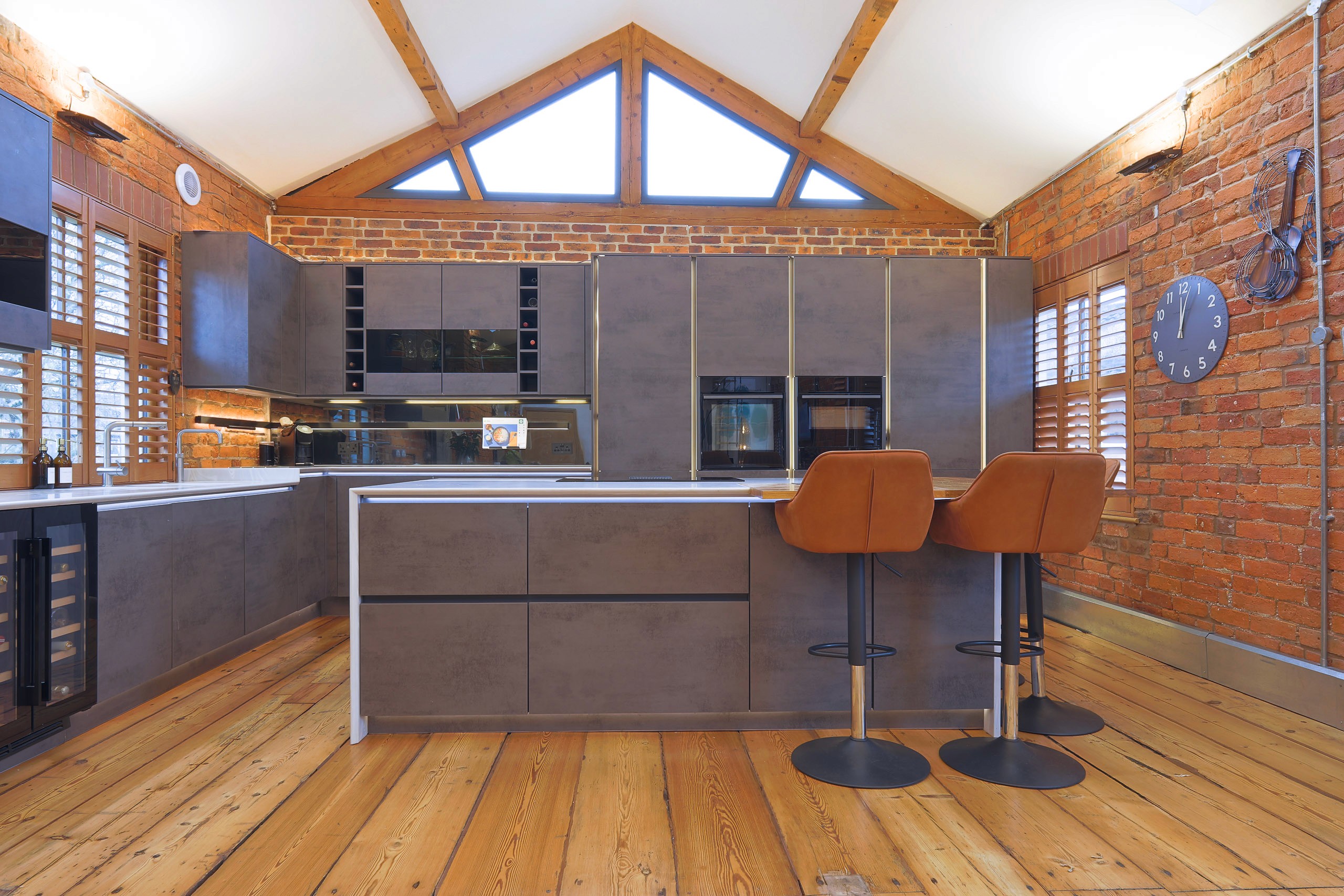 modern handleless concrete kitchen with corian worktops in wilmslow cheshire 
