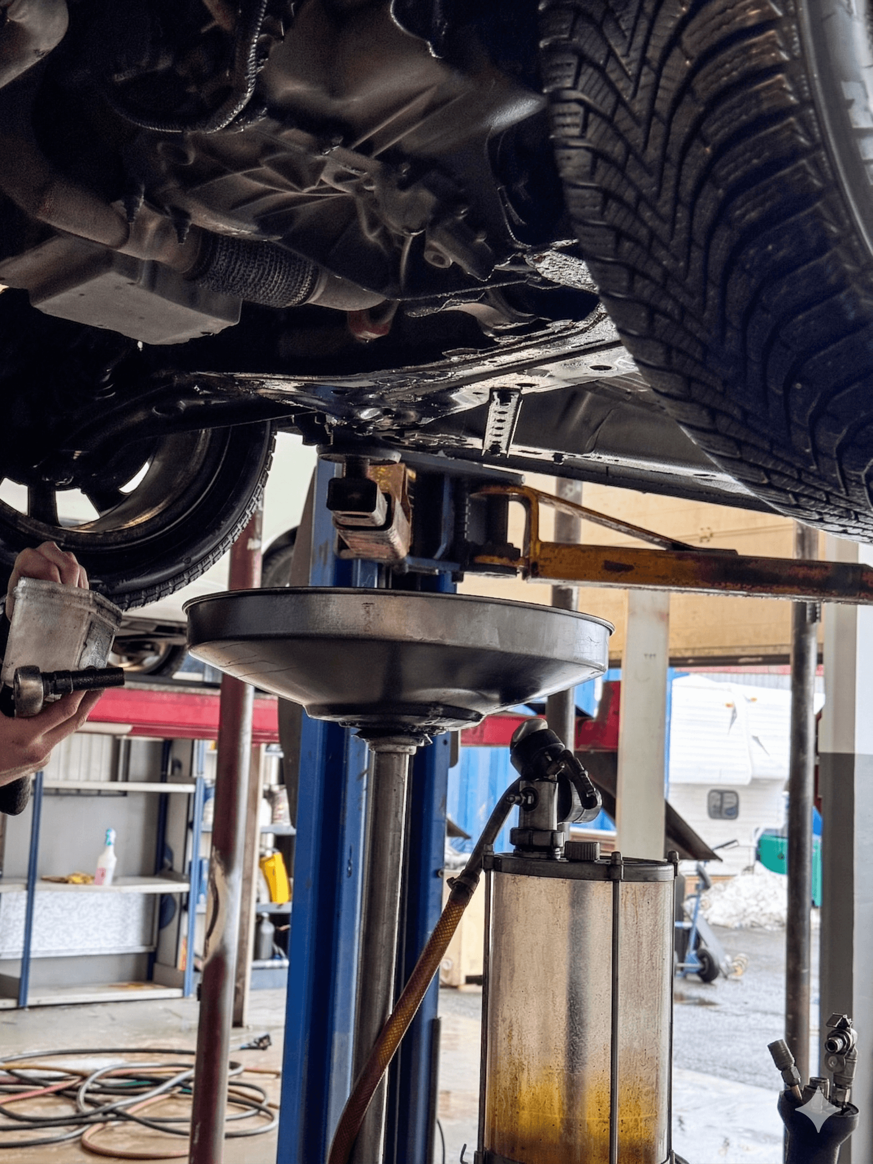 a man working on a tire in a garage