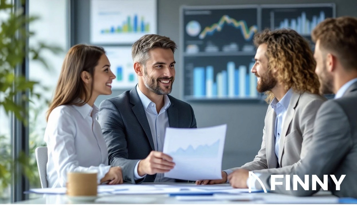  professional business meeting with four individuals dressed in business attire, engaged in a discussion.