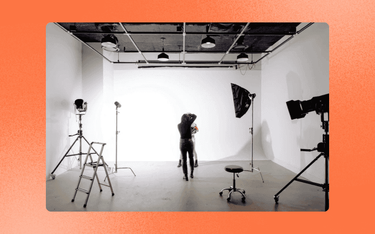 A photographer and a model in a photo studio.