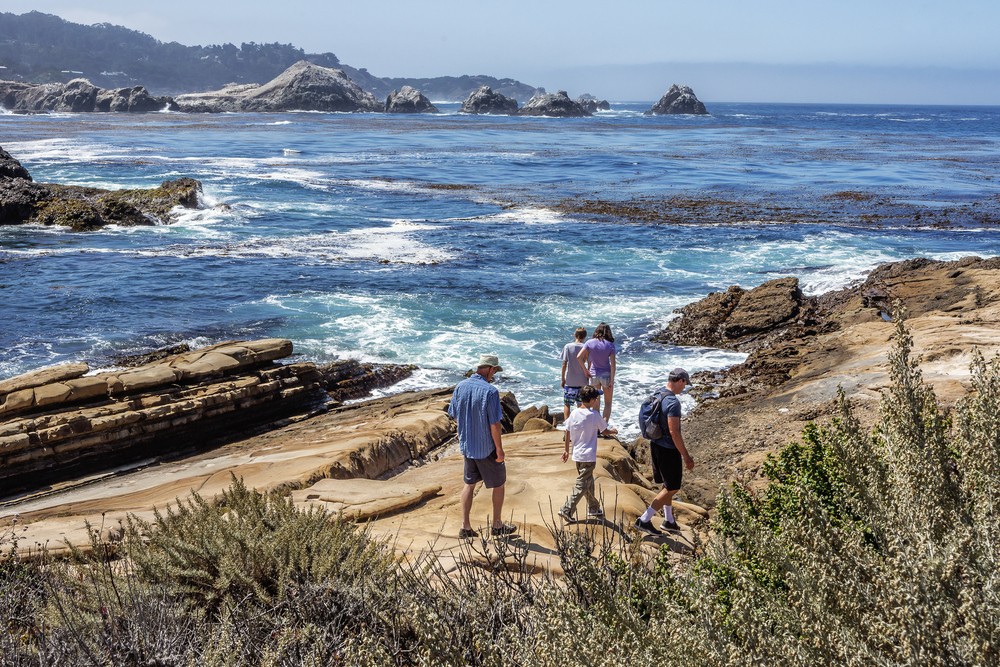 family hiking the coast in Monterey CA
