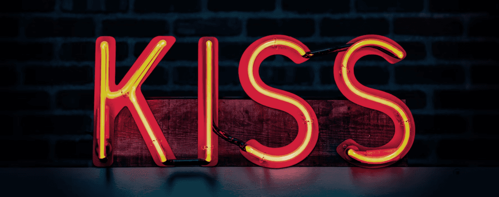 Neon sign that says "KISS". Credit: Tim Mossholder - Unsplash