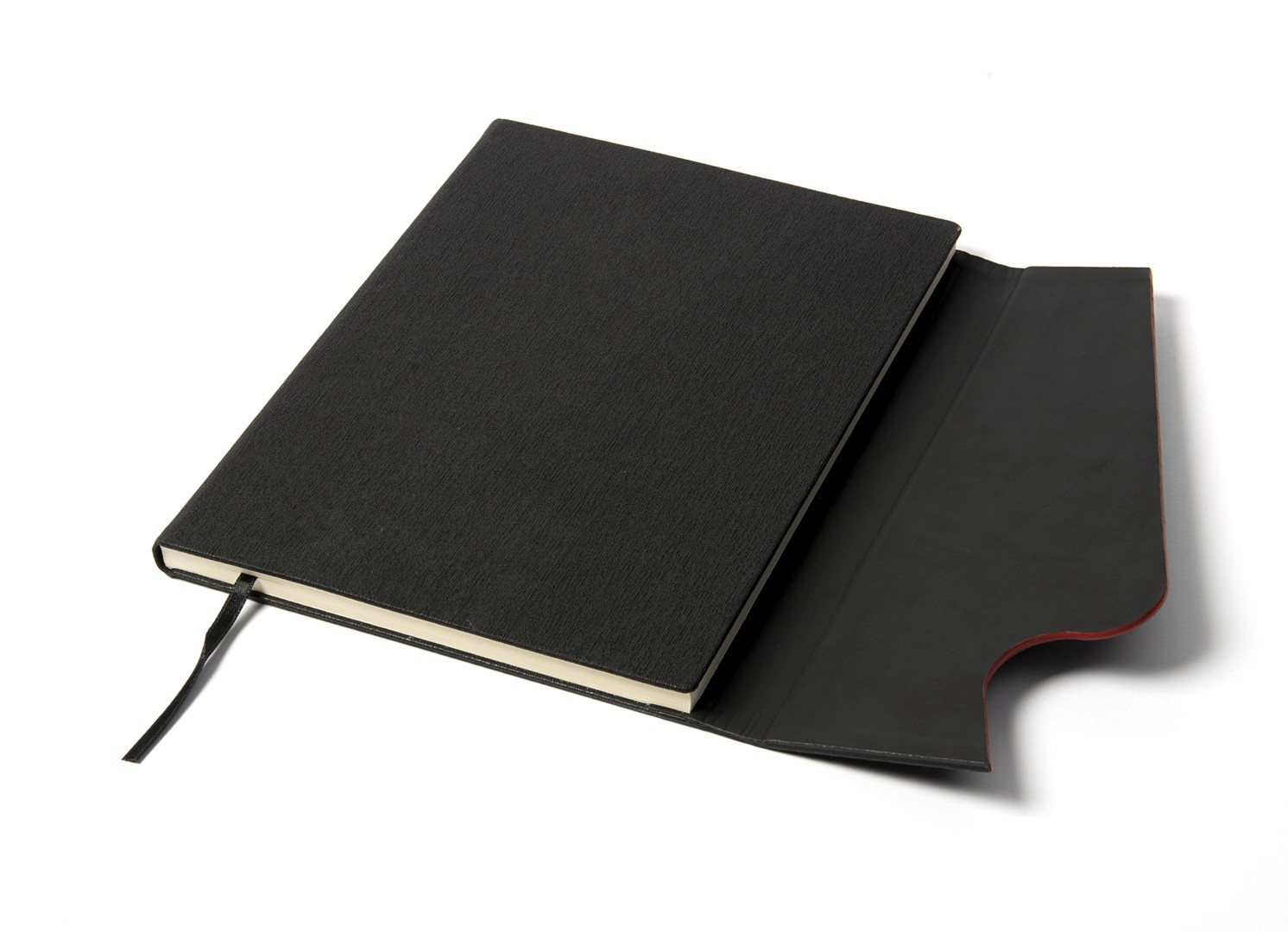 Angled view of black notebook with open flap revealing red interior lining.