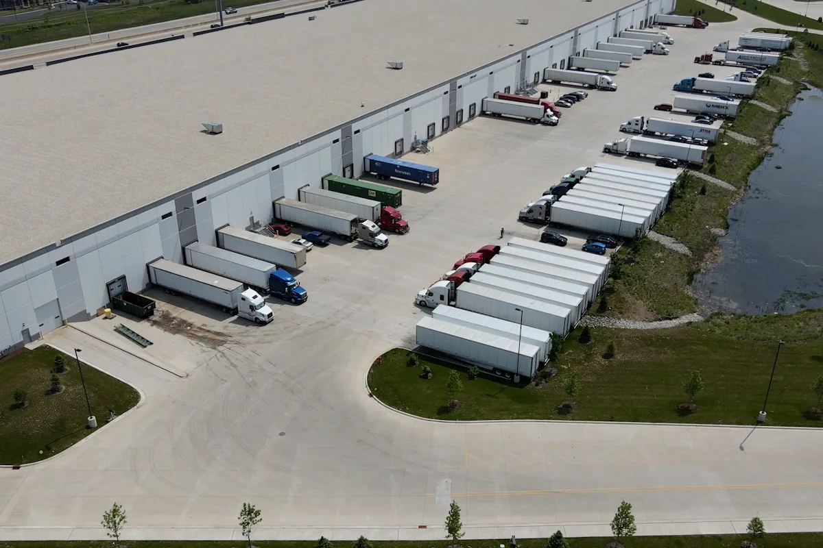 Axis Warehouse Exterior with Trucks at Docks