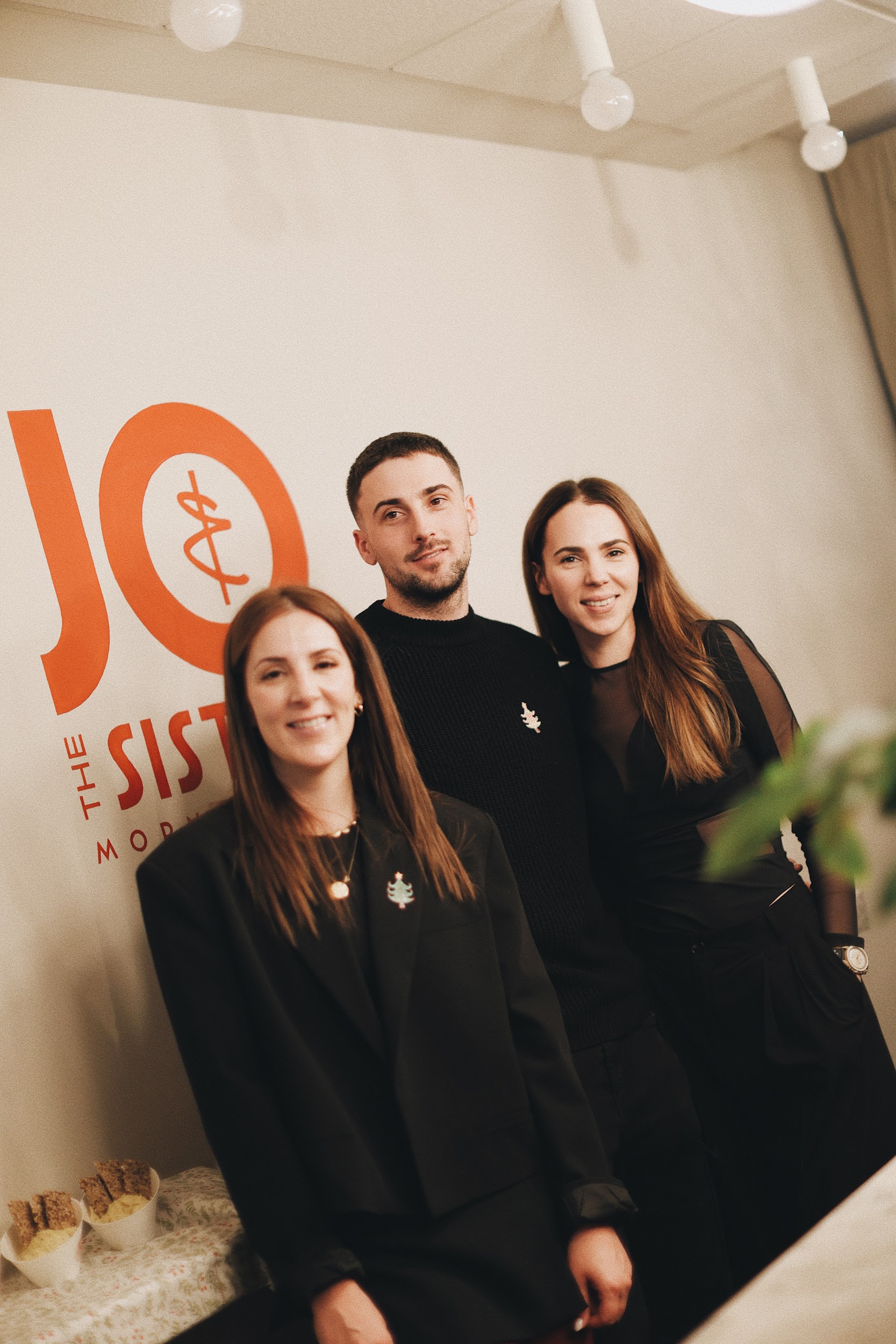 woman in black tank top holding clear wine glass