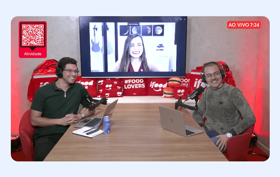 person in red shirt wearing black and gray headphones
