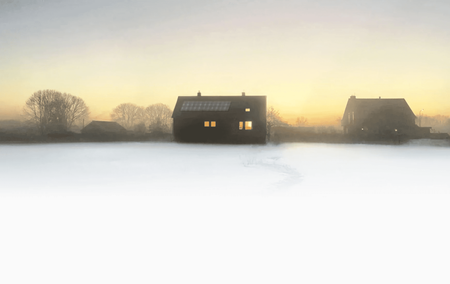 Eeen Nederlands landschap in de kou met ene heerlijk verwarmd huis.