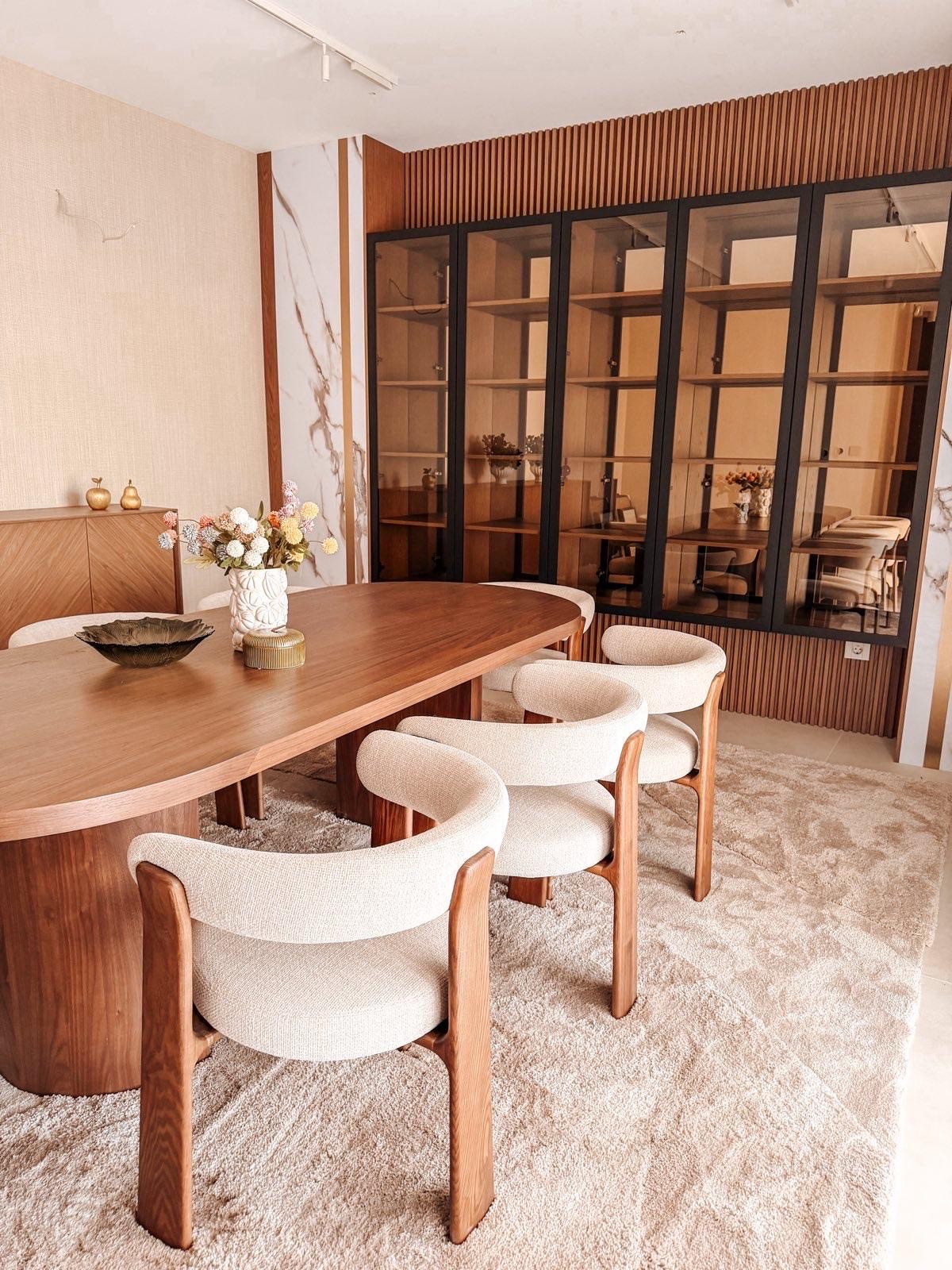 Ornate classic bathroom with claw-foot tub and wood paneling.