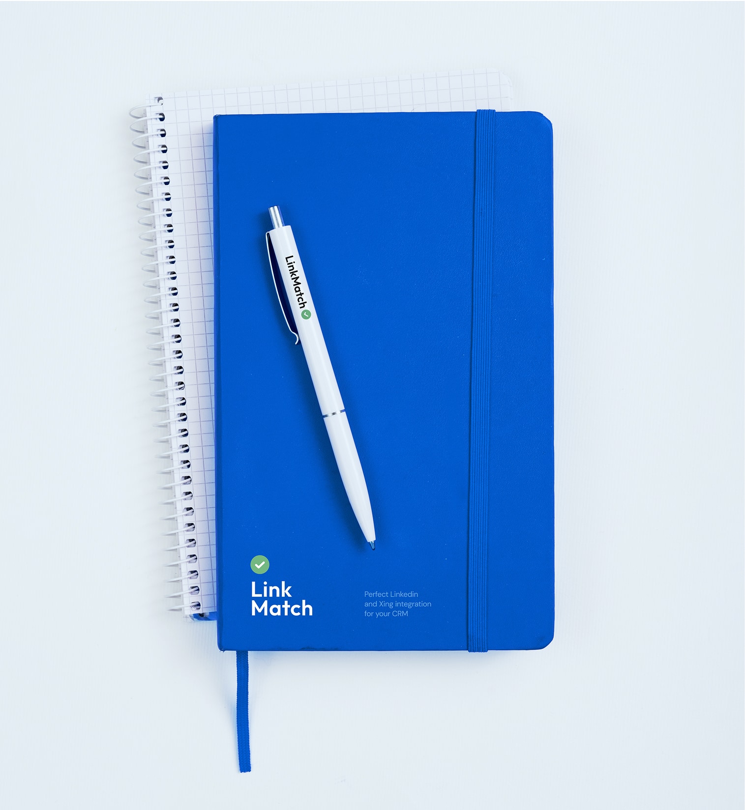LinkMatch branded notebook and pen set arranged on a clean white workspace