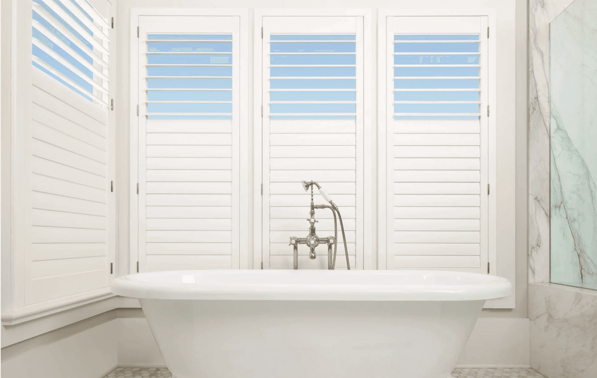 Palm Beach Polysatin shutters in Bathroom with Divider Rail 