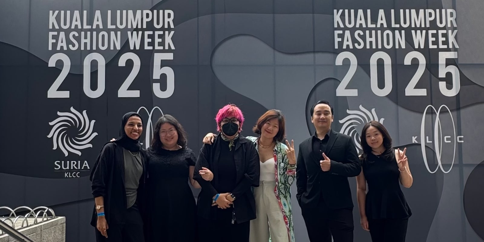 A group of influencers and professionals at the Kuala Lumpur Fashion Week 2025, showcasing a collaborative and tech-driven approach.