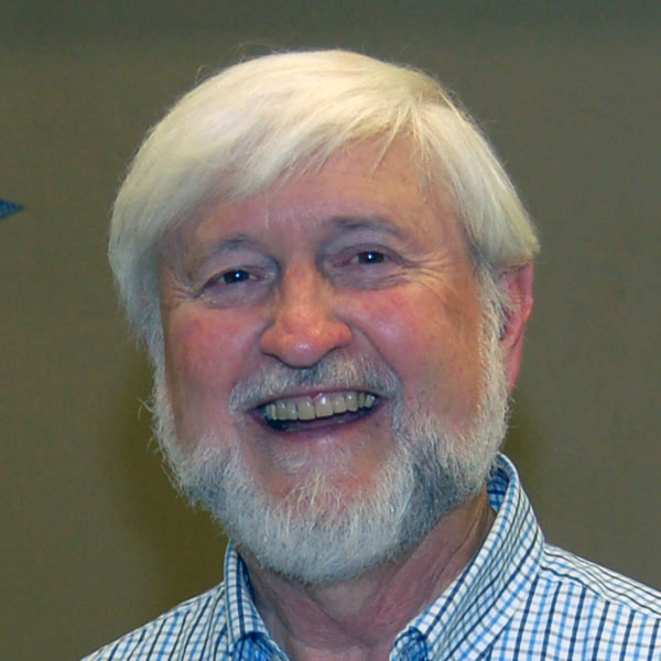 woman in gray coat singing on stage