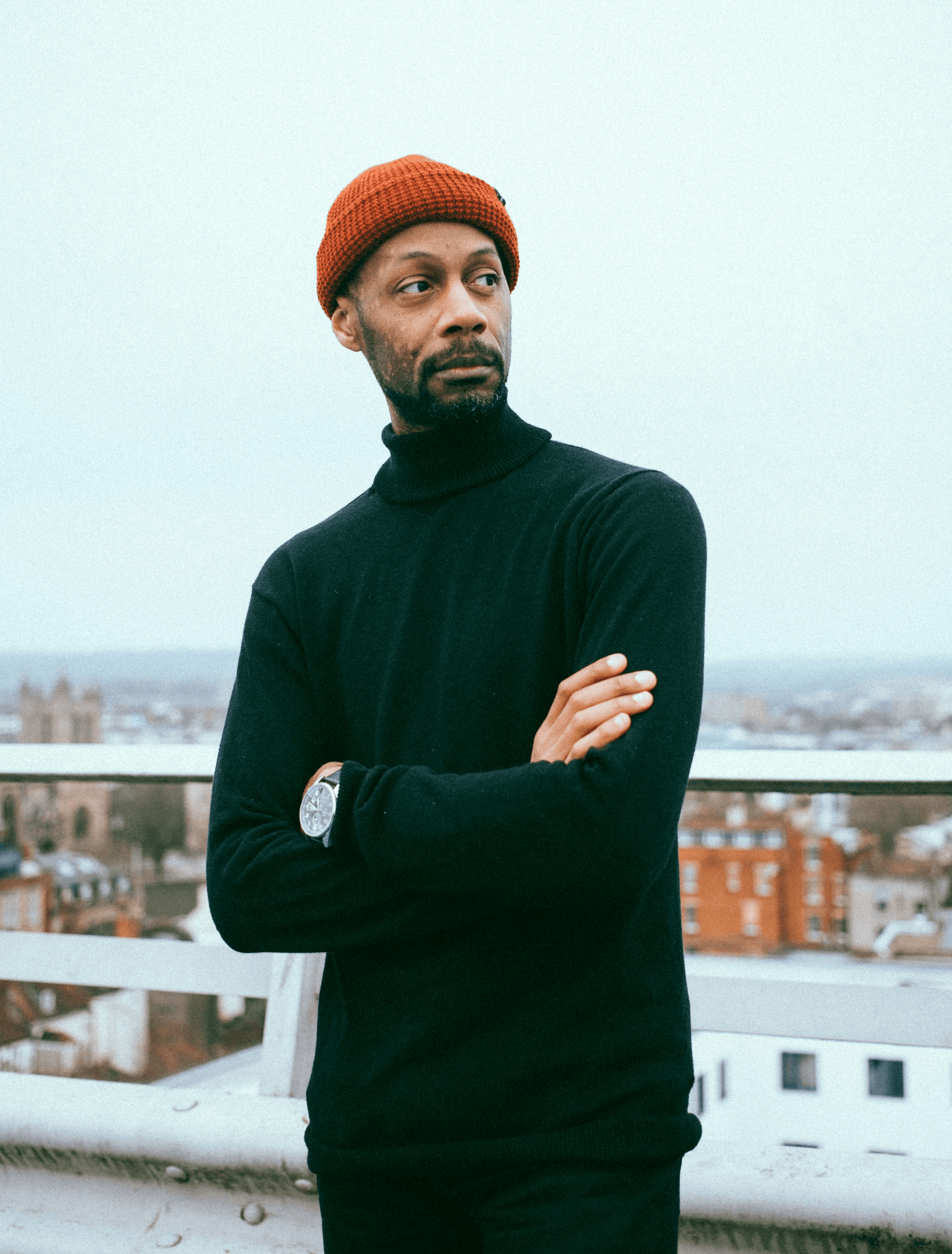 man standing near balcony