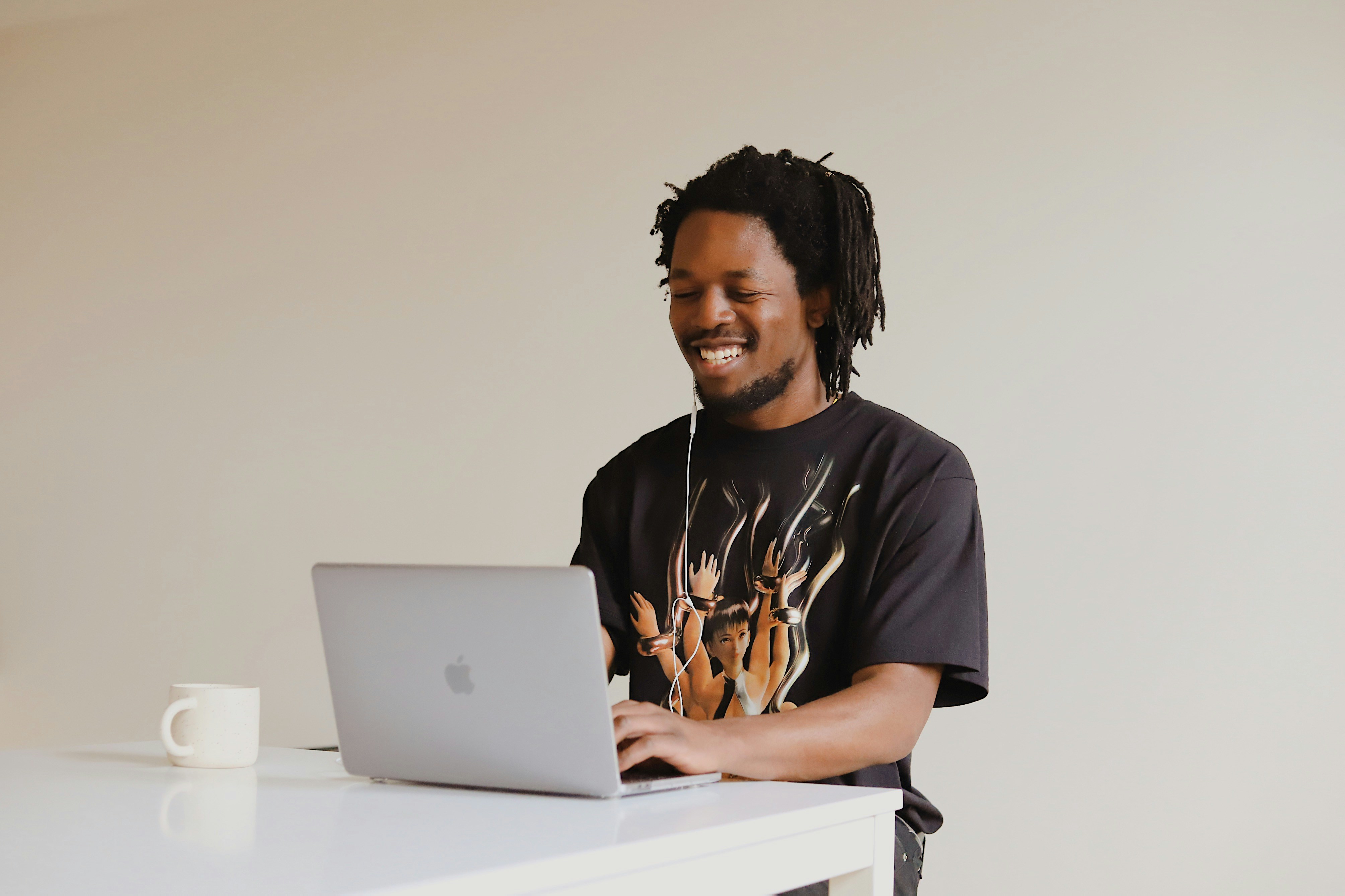 A man sitting on the floor using a laptop computer (Background Removed)