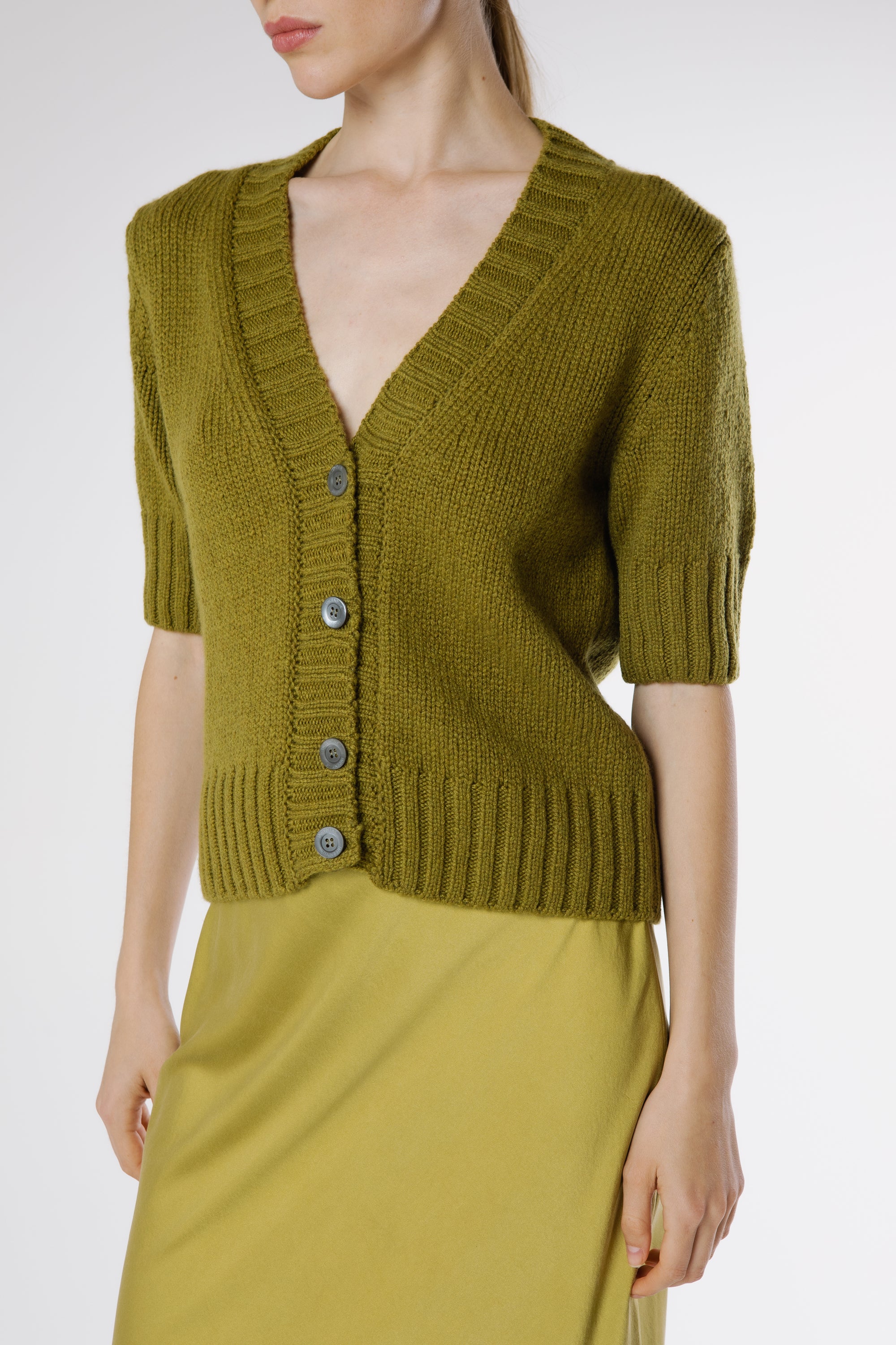 Close-up of Artemisa Cashmere Cardigan Juniper showing premium cashmere texture and tonal button details.
