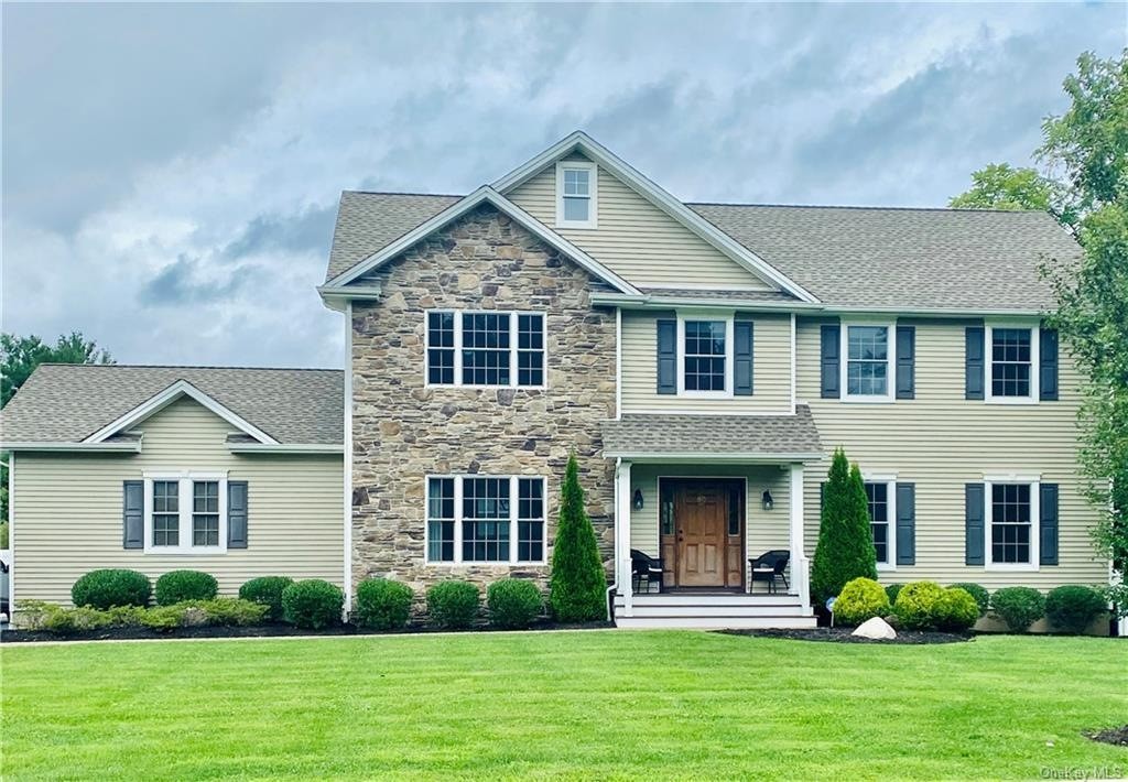 white concrete building with swimming pool