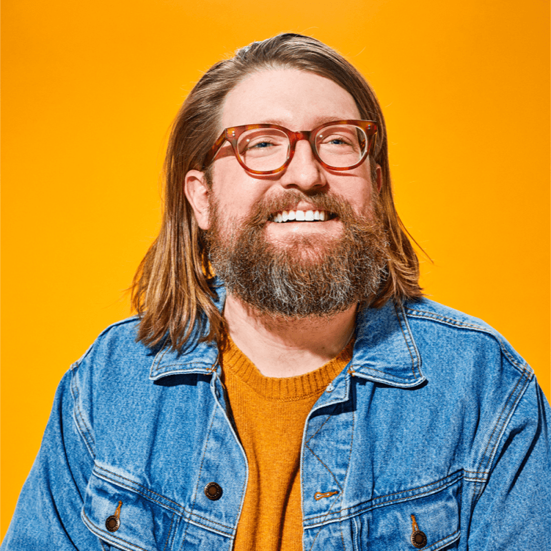 man standing near white wall