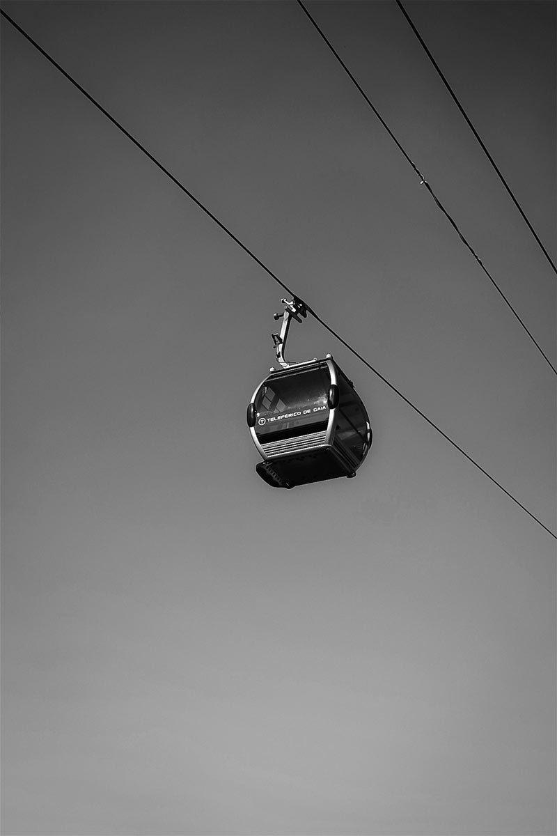 Cable car gondola above Porto cityscape - Azulejo tiles and river views