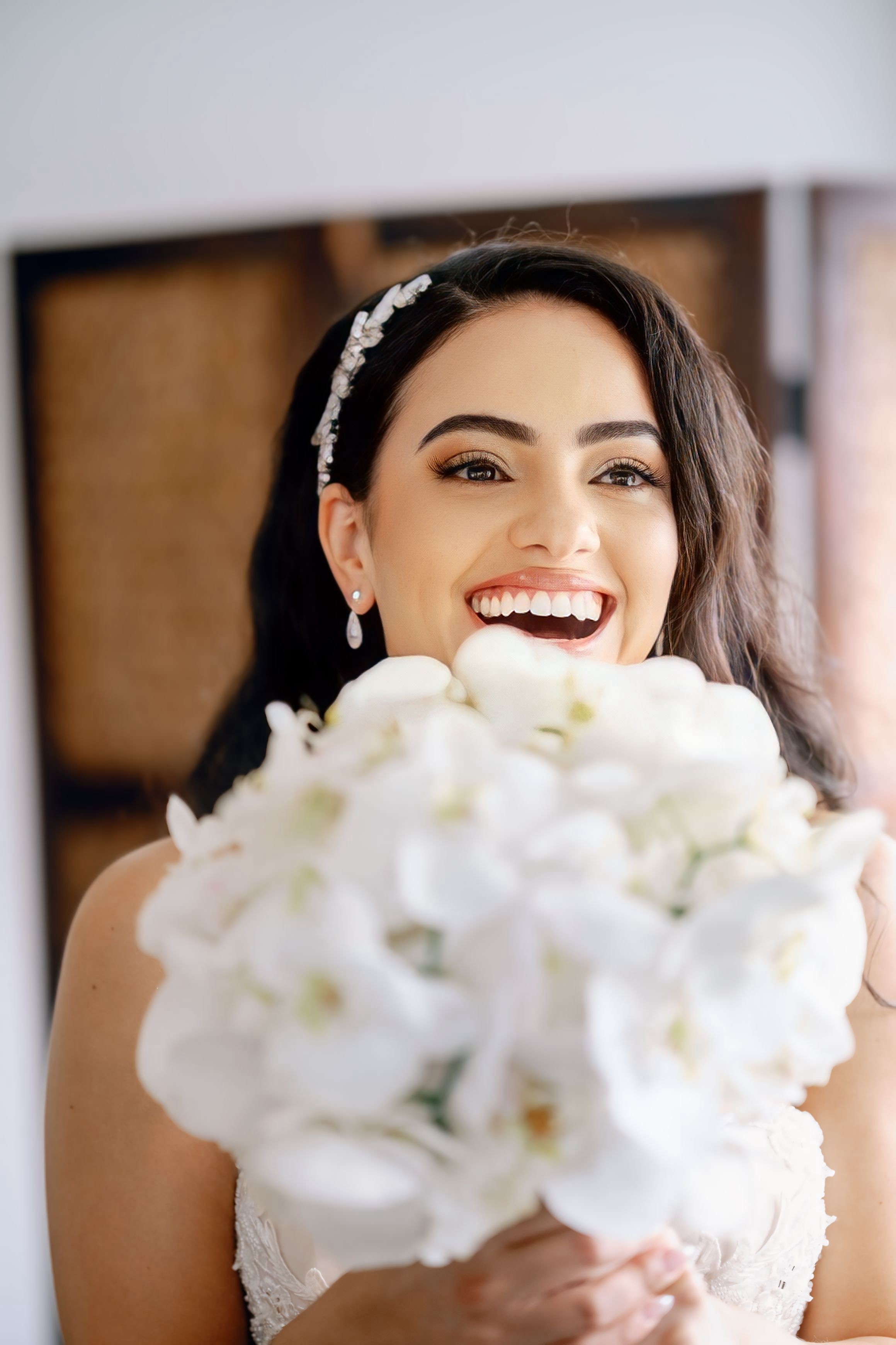 bride holding boquet smiling