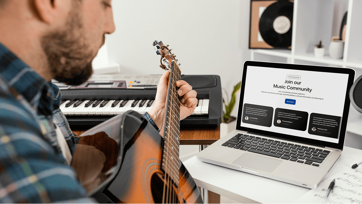 Portrait of a woman with curly hair wearing a two-tone gray and orange beanie against a neutral background.