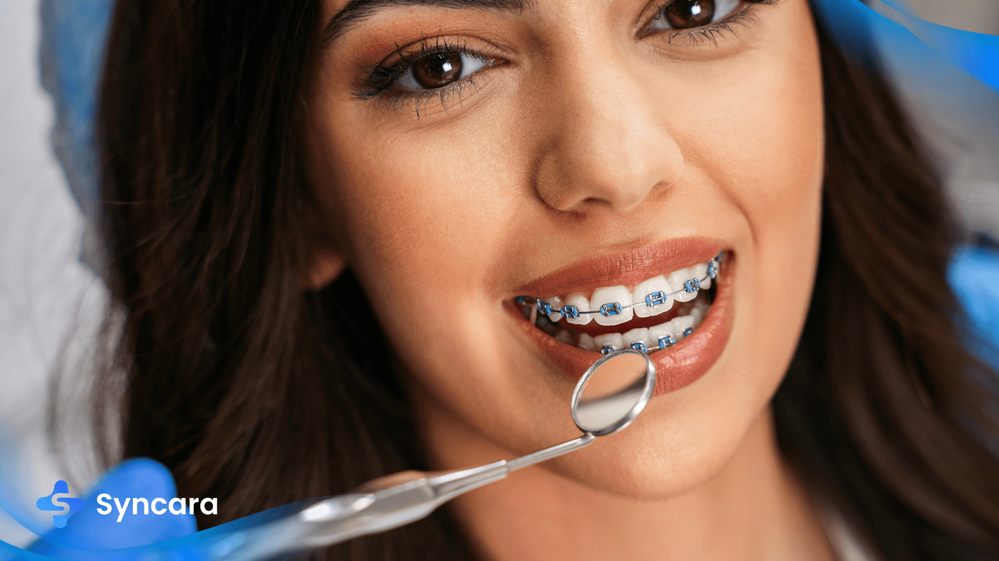 Female patient undergoing orthodontic treatment with metal braces on teeth.